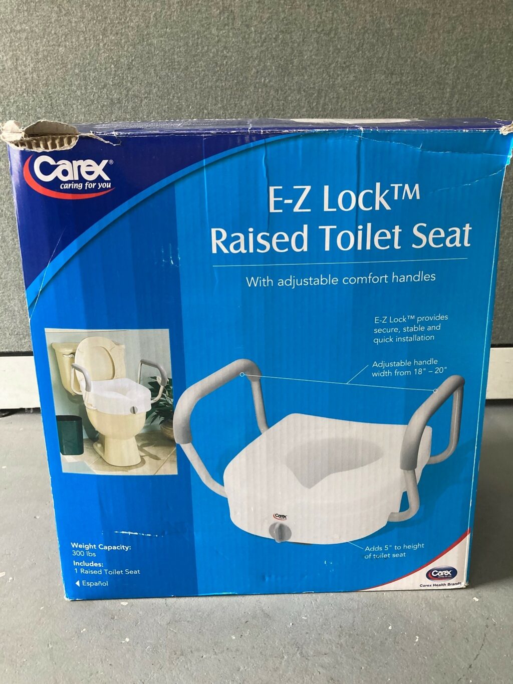 Raised toilet seat w/handles REM